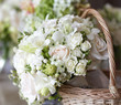 Photo: Beautiful white wedding bouquets in basket Beautiful white wedding bouquets in basket