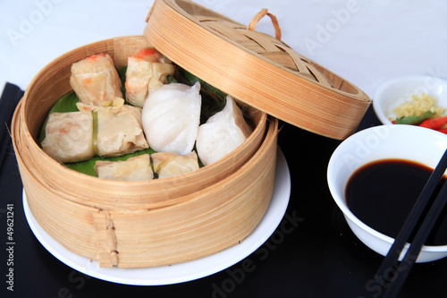 Photo: dimsum chinese food in bamboo basket dimsum chinese food in bamboo basket
