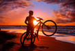Photo: Woman with bicycle on the beach Woman with bicycle on the beach