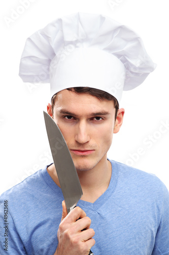 Photo: Man with chef hat and knifes Man with chef hat and knifes