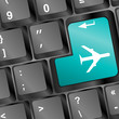 Online tickets key on the keyboard with airplane