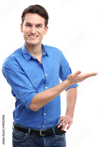 Photo: Young man presenting something Young man presenting something