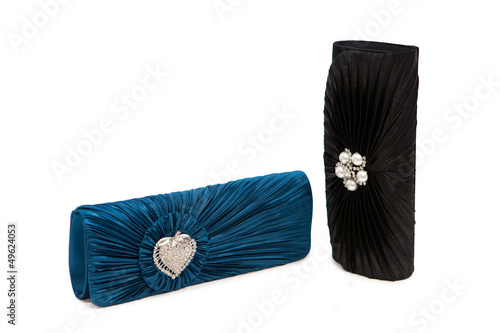 Photo: Luxurious clutch bags isolated on white Luxurious clutch bags isolated on white