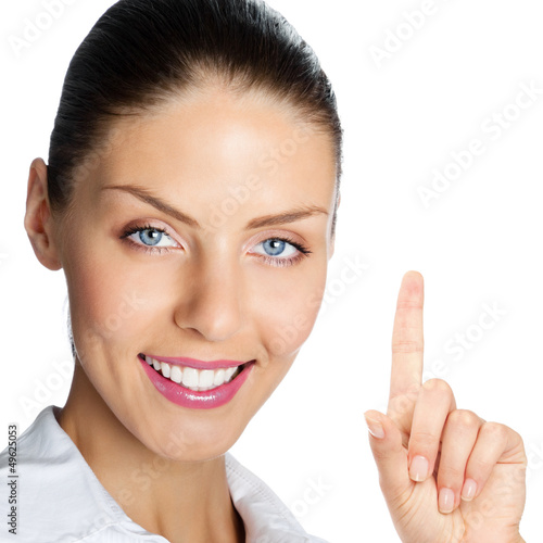Photo: Cheerful businesswoman showing, over white Cheerful businesswoman showing, over white