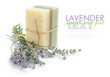 Handmade soap and lavender flowers on a white background