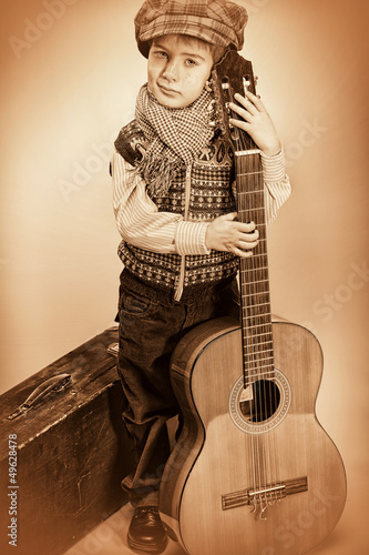 Photo: kid and guitar kid and guitar