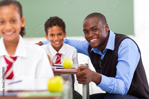 Photo: african elementary school teacher and students in classroom african elementary school teacher and students in classroom