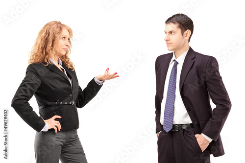 Photo: Mature female in a formal wear having a conversation with a youn Mature female in a formal wear having a conversation with a youn