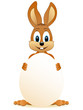Osterhase hinter einem Ei