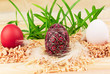 Three Easter eggs in nests