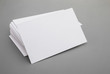 blank business cards stack up on grey background