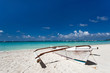 Wooden boat on tropical beach
