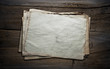 Photo: old papers on wooden background old papers on wooden background