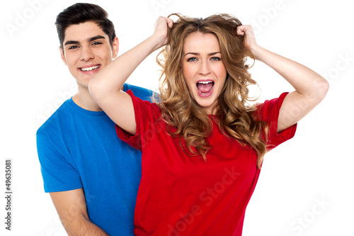 Photo: Madness at its best. Girl screaming in fun Madness at its best. Girl screaming in fun