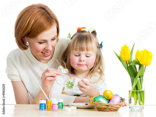 Photo: mother and daughter kid painting easter eggs isolated mother and daughter kid painting easter eggs isolated