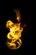 isolated fire flames on black background, darkness