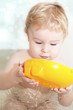 The beautiful child, bathing with toys