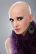 Portrait of hairless woman in purple boa