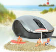 On line holiday concept with mouse and sunbathers on beach