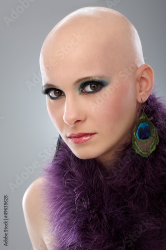 Photo: Portrait of hairless woman in purple boa Portrait of hairless woman in purple boa