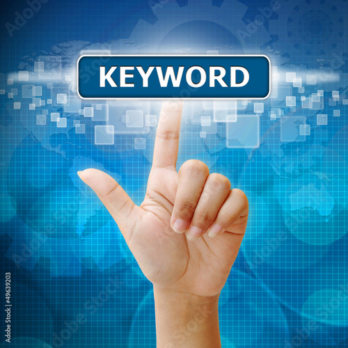 Photo: Hand woman press on touch screen keyword seo button Hand woman press on touch screen keyword seo button