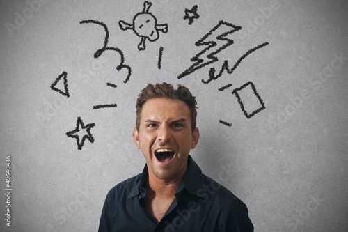 Photo: Businessman with angry expression Businessman with angry expression