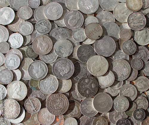 Photo: Ancient silver coins in a background photo Ancient silver coins in a background photo
