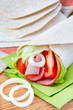 Fresh tortilla with vegetables and ham