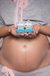 Woman holding baby shoes