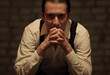 Portrait of young serious mafia man