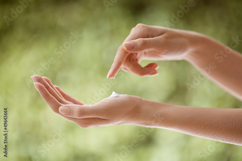 Photo: Beautiful Woman Hands Applying Cream Beautiful Woman Hands Applying Cream