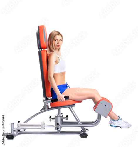 Photo: Young woman on isodynamic exerciser Young woman on isodynamic exerciser