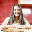 Brunette woman sitting on chair