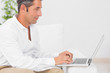Concentrated man using his laptop