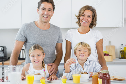 Photo: Happy family at breakfast Happy family at breakfast
