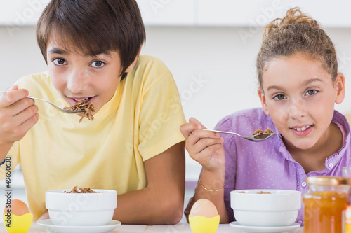 Photo: Happy siblings having breakfast Happy siblings having breakfast