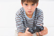 Boy playing his game console