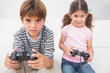 Brother and sister playing video games