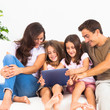 Pretty family using a digital tablet