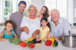 Multi-generation family cutting vegetables together