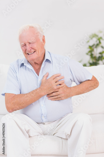 Photo: Aged man suffering with heart pain Aged man suffering with heart pain