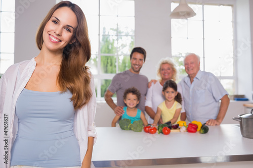 Photo: Mother in front of her family Mother in front of her family