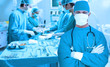 Side view of a medical team operating