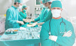 Side view of a medical team operating