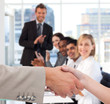 Businessman and woman shaking hands