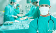 Photo: Side view of a medical team operating Side view of a medical team operating