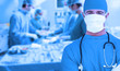 Side view of a medical team operating