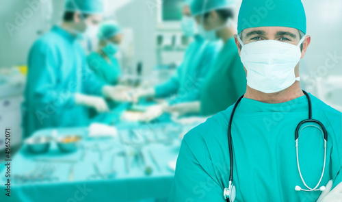 Photo: Side view of a medical team operating Side view of a medical team operating