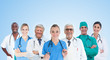 Medical team standing in line on blue background