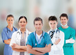 Photo: Smiling hospital workers standing in line Smiling hospital workers standing in line
